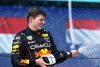 MIAMI, FLORIDA - MAY 08: Race winner Max Verstappen of the Netherlands and Oracle Red Bull Racing celebrates on the podium during the F1 Grand Prix of Miami at the Miami International Autodrome on May 08, 2022 in Miami, Florida. (Photo by Mark Thompson/Getty Images) // Getty Images / Red Bull Content Pool // SI202205090012 // Usage for editorial use only //